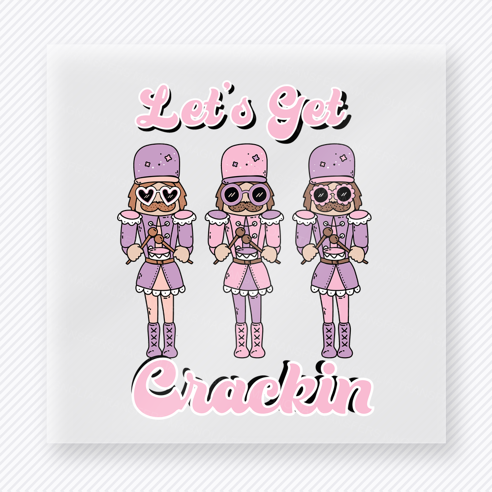 Let's Get Crackin Nutcrackers Christmas DTF transfer featuring three pink nutcrackers with Let's Get Crackin text