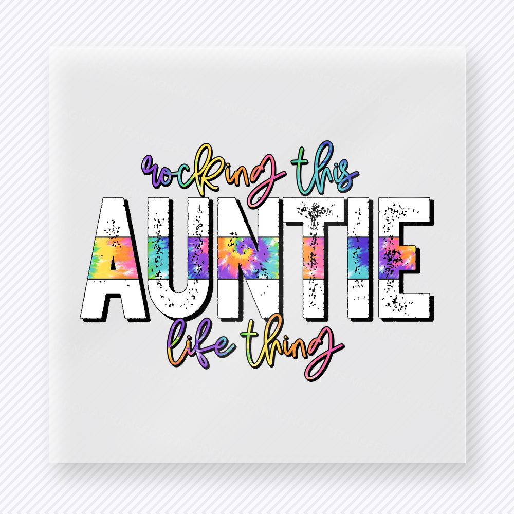 Rocking This Auntie Life Thing family DTF transfer design featuring playful distressed AUNTIE lettering filled with rainbow tie-dye accents and colorful handwritten script