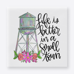 Life Is Better In A Small Town DTF transfer mockup with a pastel water tower with flowers and greenery sits beside hand-lettered Life Is Better In A Small Town wording for a sweet rural country-life style.