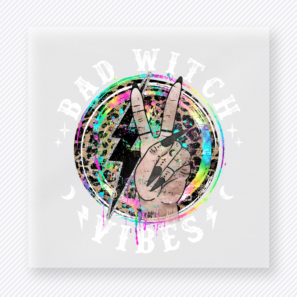 Bad Witch Vibes Halloween DTF transfer with white lettering, peace sign hand, and glitter circle