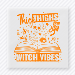Thick Thighs and Witch Vibes Halloween DTF transfer featuring the phrase Thick Thighs and Witch Vibes above an open spell book in bright orange Halloween color