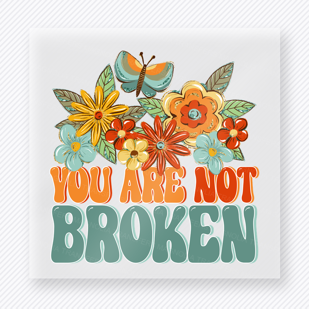 You Are Not Broken motivational DTF transfer mockup with retro floral artwork with bold teal and orange lettering