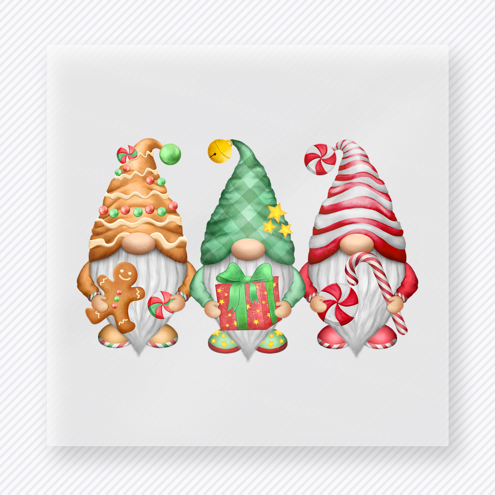Christmas Gnome Trio Christmas DTF transfer featuring a cute trio of Christmas gnomes in gingerbread and candy cane colors
